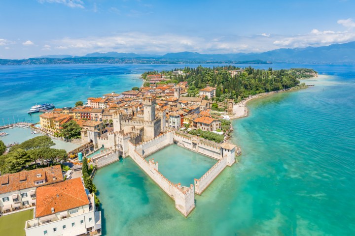 a body of water with a city in the background