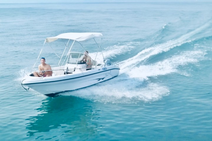 a small boat in a body of water